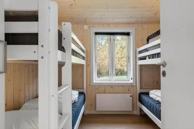 a room with two bunk beds and a window at 1028-Thisted-Tingbakken-28 in Torsted