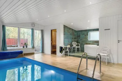 a house with a swimming pool and a tub at 1028-Thisted-Tingbakken-28 in Torsted