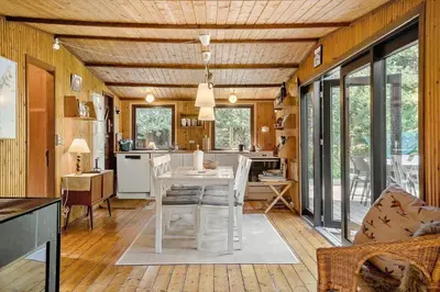a kitchen and living room with a table and chairs at 242-Thisted-Muslingevej-4 in Thisted