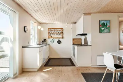 a kitchen with white cabinets and a counter top at 870-Thisted-Nordsovej-34 in Thisted