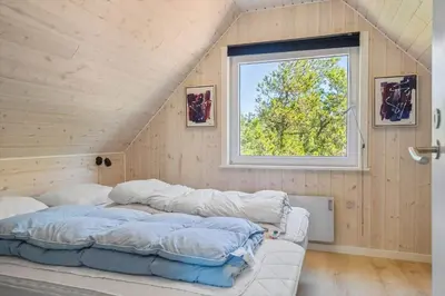 a bed in a room with a window at 420-Vestervig-Kanalvej-4 in Vestervig