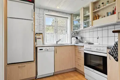 a kitchen with white appliances and a window at 727-Thisted-Blamunkevej-11 in Thisted