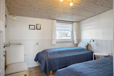 a bedroom with two beds and a window at 608-Thisted-Vesterhavsgade-49-A in Thisted