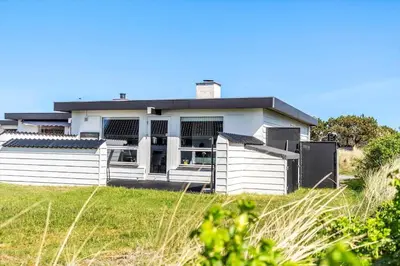 a white house with a fence in front of it at 586-Thisted-Havbovej-30 in Thisted