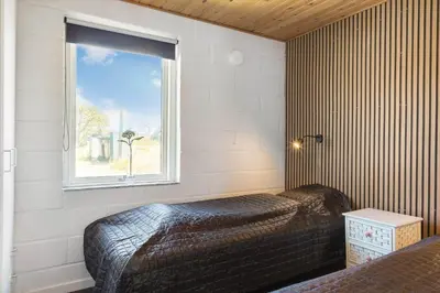 a bedroom with a bed and a window at 586-Thisted-Havbovej-30 in Thisted