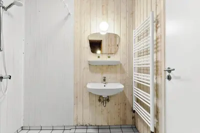 a bathroom with a sink and a mirror at 975-Thisted-Klitstien-45 in Torsted
