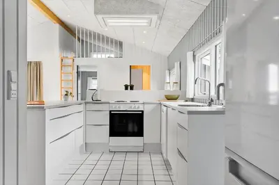 a white kitchen with a sink and a dishwasher at 975-Thisted-Klitstien-45 in Torsted