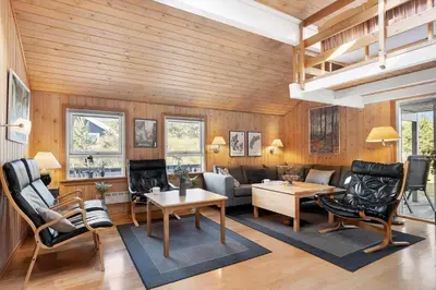 a living room with wooden walls and wooden floors at 675-Thisted-Tunvej-15 in Thisted