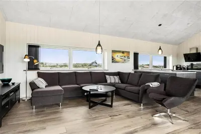 a living room with a couch and a table at 899-Snedsted-Somaerkevej-76-B in Snedsted