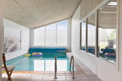 a swimming pool in a room with a large window at 446-Thisted-Nordsovej-206-F in Thisted