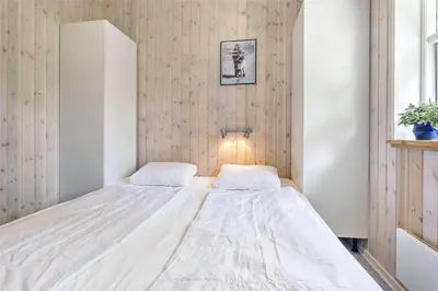 a bedroom with a large white bed in it at 879-Thisted-Pighvarvej-3 in Thisted