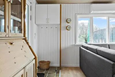 a living room with a couch and a window at 145-Thisted-Fiskervej-25-B in Thisted