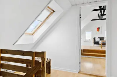a white room with a staircase and a window at 822-Thisted-Bredkaervej-8 in Thisted