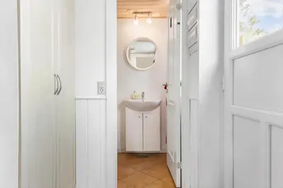 a bathroom with a sink and a mirror at 1050-Thisted-Spanggardsvej-5 in Torsted