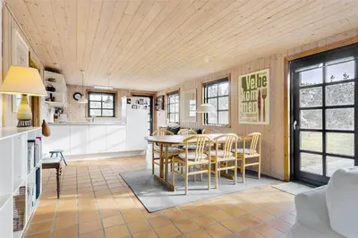 a kitchen and dining room with a table and chairs at 520-Snedsted-Sarasvej-10 in Snedsted