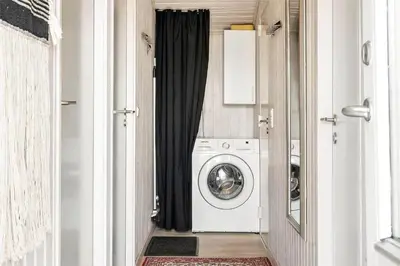 a washer and dryer in a laundry room with a window at 770-Thisted-Nordsovej-180 in Thisted