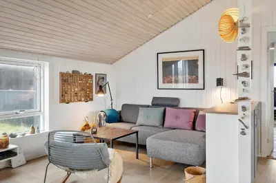 a living room with a couch and a table at 904-Thisted-P-Bolesens-Vej-15 in Torsted