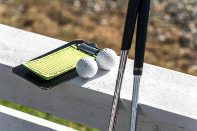 two golf balls and a bat on a bench at 266-Vestervig-Havnevej-1-lejl-19 in Vestervig