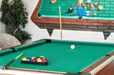 a green pool table with balls and a cue at 266-Vestervig-Havnevej-1-lejl-19 in Vestervig
