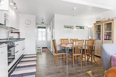 a kitchen and dining room with a table and chairs at 417-Vestervig-Havnevej-1-lejl-17 in Vestervig