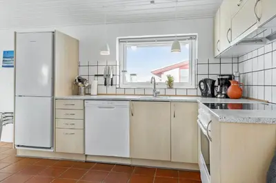 a kitchen with white appliances and a window at 760-Thisted-Pighvarvej-30 in Thisted