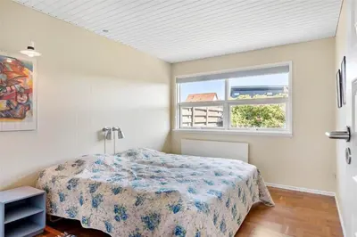 a bedroom with a bed and a window at 659-Thisted-Orredvej-7 in Thisted