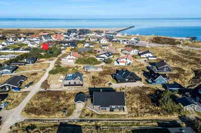 an aerial view of a residential neighborhood with the ocean at 659-Thisted-Orredvej-7 in Thisted