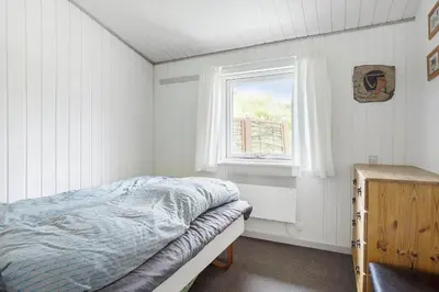 a bedroom with a bed and a window at 619-Thisted-Blabaervej-32 in Thisted