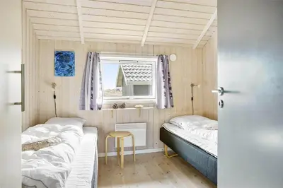 a small room with two beds and a window at 938-Thisted-Niels-Vognmands-Vej-8 in Torsted