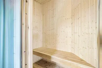 a small sauna with a wooden bench in it at 938-Thisted-Niels-Vognmands-Vej-8 in Torsted