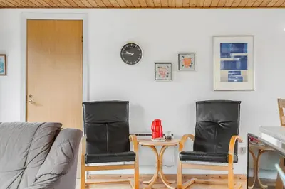 two chairs and a table in a living room at 882-Thisted-Nordsovej-100 in Thisted