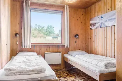 two beds in a room with a window at 882-Thisted-Nordsovej-100 in Thisted