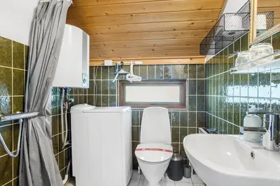 a bathroom with a toilet and a sink at 834-Thisted-Revlingvej-9 in Thisted