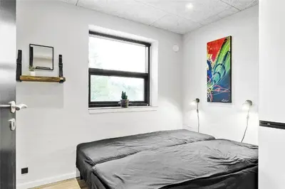 a bedroom with a bed and a window at 927-Thisted-Spanggardsvej-77 in Torsted