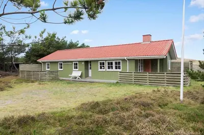 a green house with a red roof at 861-Thisted-Havbovej-41 in Thisted
