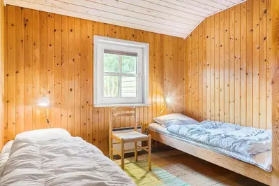 a bedroom with two beds and a window at 861-Thisted-Havbovej-41 in Thisted
