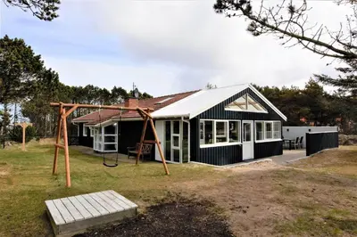 a house with a swing and a playground at 599-Thisted-Fiskervej-165 in Thisted