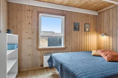 a bedroom with a bed and a window at 376-Thisted-Fiskervej-55 in Thisted