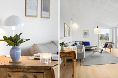 a living room and a living room with a table at 1305-Snedsted-Klitfogedvej-5 in Snedsted