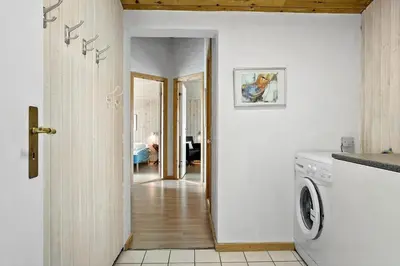 a hallway of a home with a washer and dryer at 928-Thisted-Kobbelsti-15 in Torsted