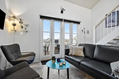 a living room with a couch and a table at 254-Vestervig-Havnevej-1-lejl-4 in Vestervig