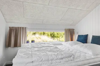 a large white bed in a room with a window at 572-Thisted-Kristinesvej-7 in Thisted