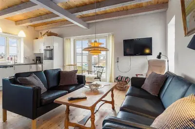 a living room with a couch and a table at 125-Thisted-Fiskervej-7 in Thisted