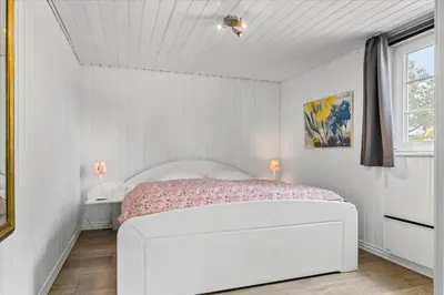 a white bedroom with a white bed in a room at 744-Thisted-Orredvej-26 in Thisted