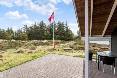 a red flag on a flag pole on a patio at 447-Thisted-Kuttervej-13 in Thisted