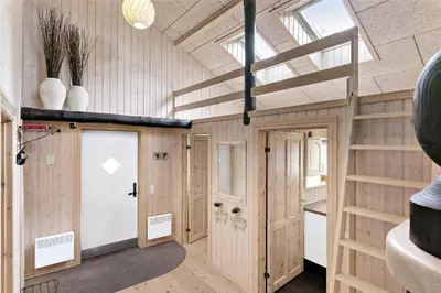 a room with wooden walls and a vaulted ceiling at 929-Thisted-Brandisvej-19 in Torsted