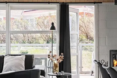 a living room with a couch and a large window at 670-Thisted-Krebsvej-4 in Thisted