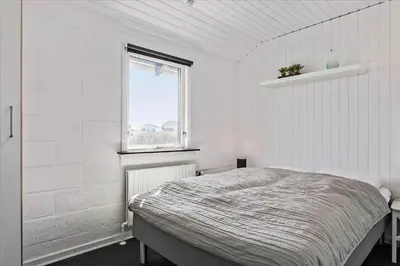 a white bedroom with a bed and a window at 670-Thisted-Krebsvej-4 in Thisted
