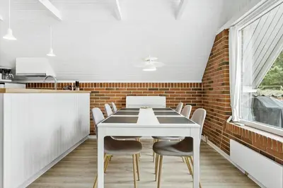 a dining room with a white table and chairs at 479-Thisted-Kristinesvej-36 in Thisted