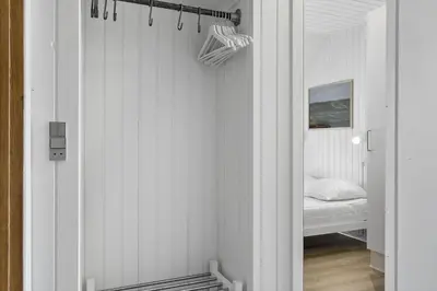 a bedroom with a bed in a room with white walls at 479-Thisted-Kristinesvej-36 in Thisted